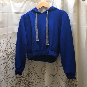 Cropped blue hoodie.